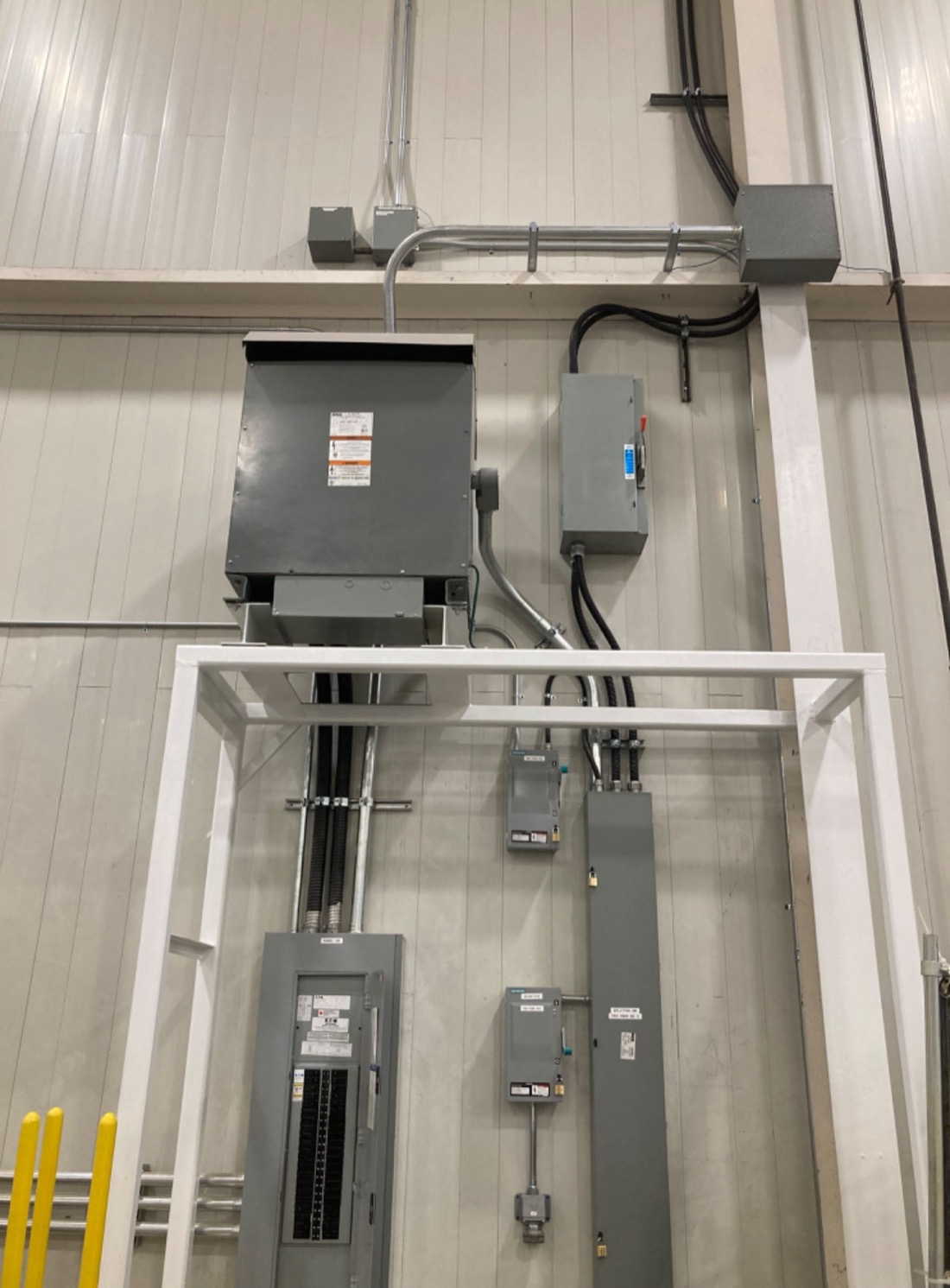 Commercial transformer and electrical panel installation in a warehouse